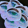 A set of five die-cut stickers featuring a repeating illustration of a green eye with dark brown eyebrows and blue eyelashes, set against a dark textured background.